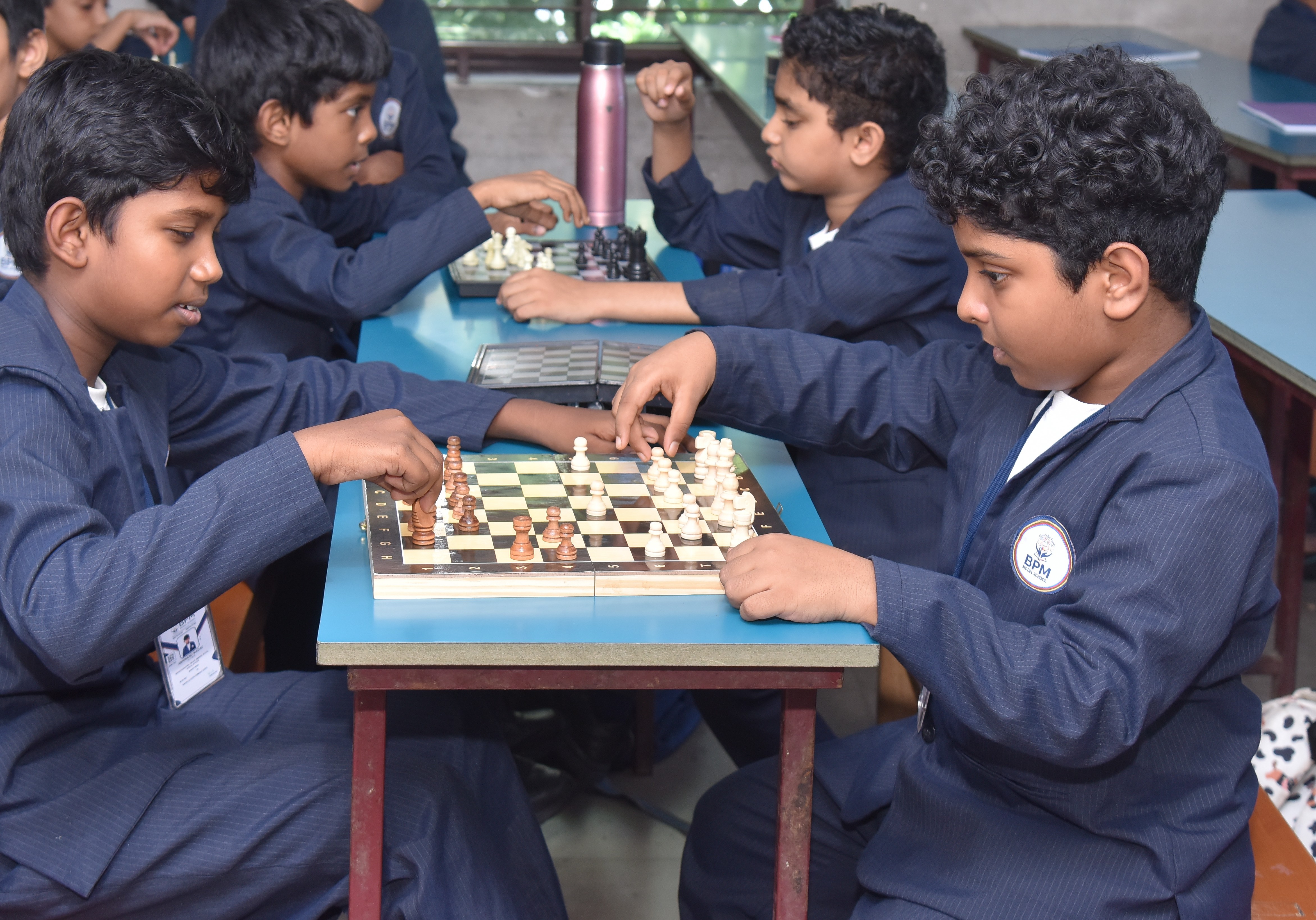 Students engaging in chess and extracurricular activities at BPM Model School Varkala, Trivandrum